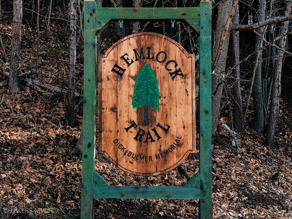 Sign indicating the Hemlock Trail trailhead in Victoria Park. 
