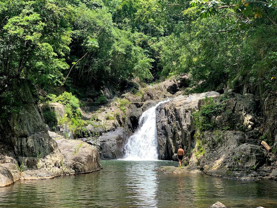 View of Crystal Cascade Falls with a waterfall and swimming hole. 