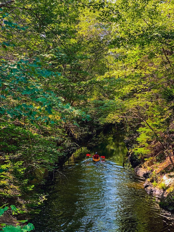 A person kayaking down the Shubie River.