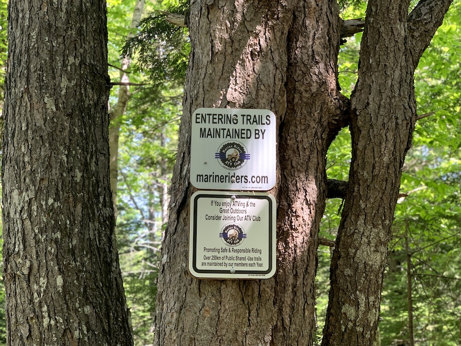 Sign letting hikers know that the Myra Road Falls trails are maintained by Marine Riders. 