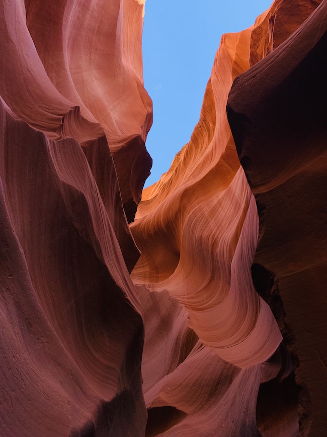 The red and orange rock walls of Antelope Canyon.