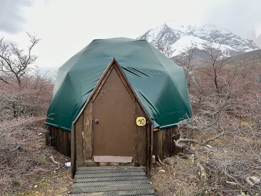 Standard dome number 10 at EcoCamp Patagonia with the mountains in the background. 