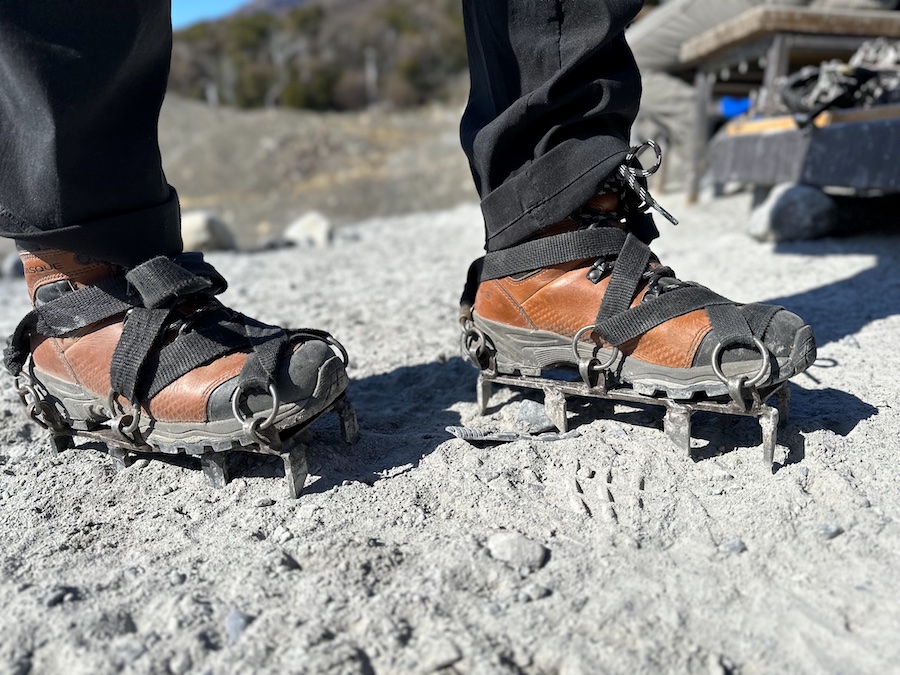 Crampons on hiking boots while trekking on Perito Moreno Glacier.